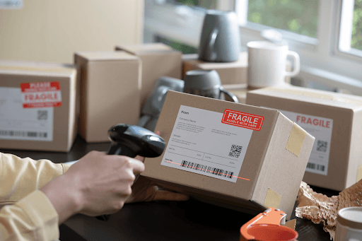 A person scanning a package