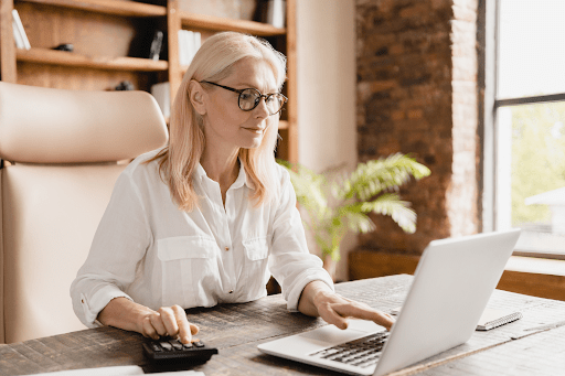 blonde womane sitting at computer