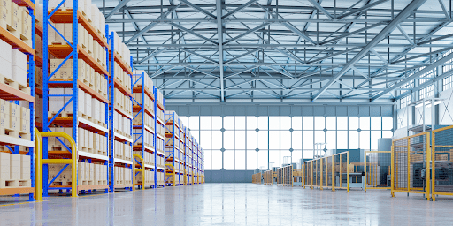 A very spacious warehouse with boxes stacked neatly on shelving